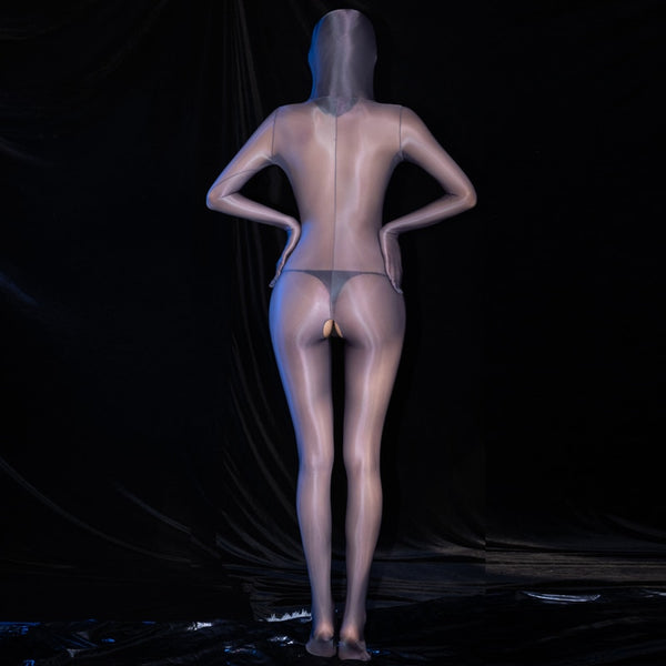 Back view of lady wearing a gray glossy sheer long sleeves bodystocking with an open crotch, closed hand, and a pull over hood.