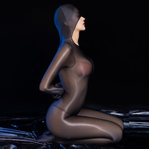 Lady wearing a black glossy sheer long sleeves bodystocking with an open crotch, closed hand, and a pull over hood.