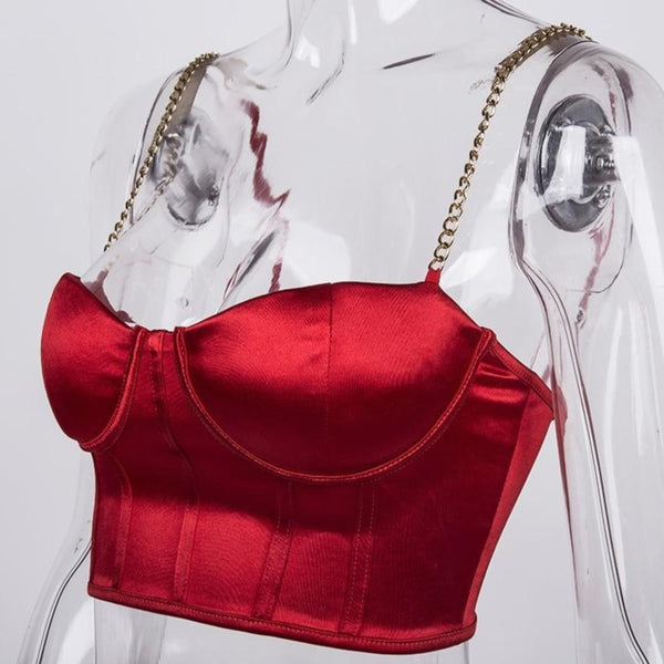 Red sexy corset crop top featuring a adjustable shoulder straps, back zipper closure and a low cut back. 