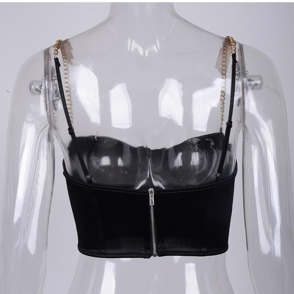 Black sexy corset crop top featuring a adjustable shoulder straps, back zipper closure and a low cut back. 