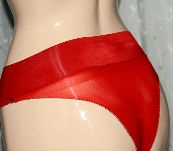 Red sheer panties featuring a wide comfortable waistband, shiny nylon, high side cut. 